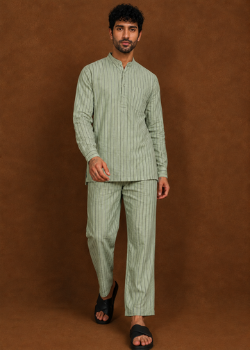 Man wearing a stylish linen cotton short kurta and pajama co-ord set with comfortable breathable fabric for casual and ethnic wear.